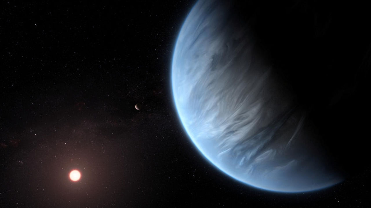 An artist's impression shows the planet K2-18b, its host star and an accompanying planet. Photo Credit: Reuters Photo