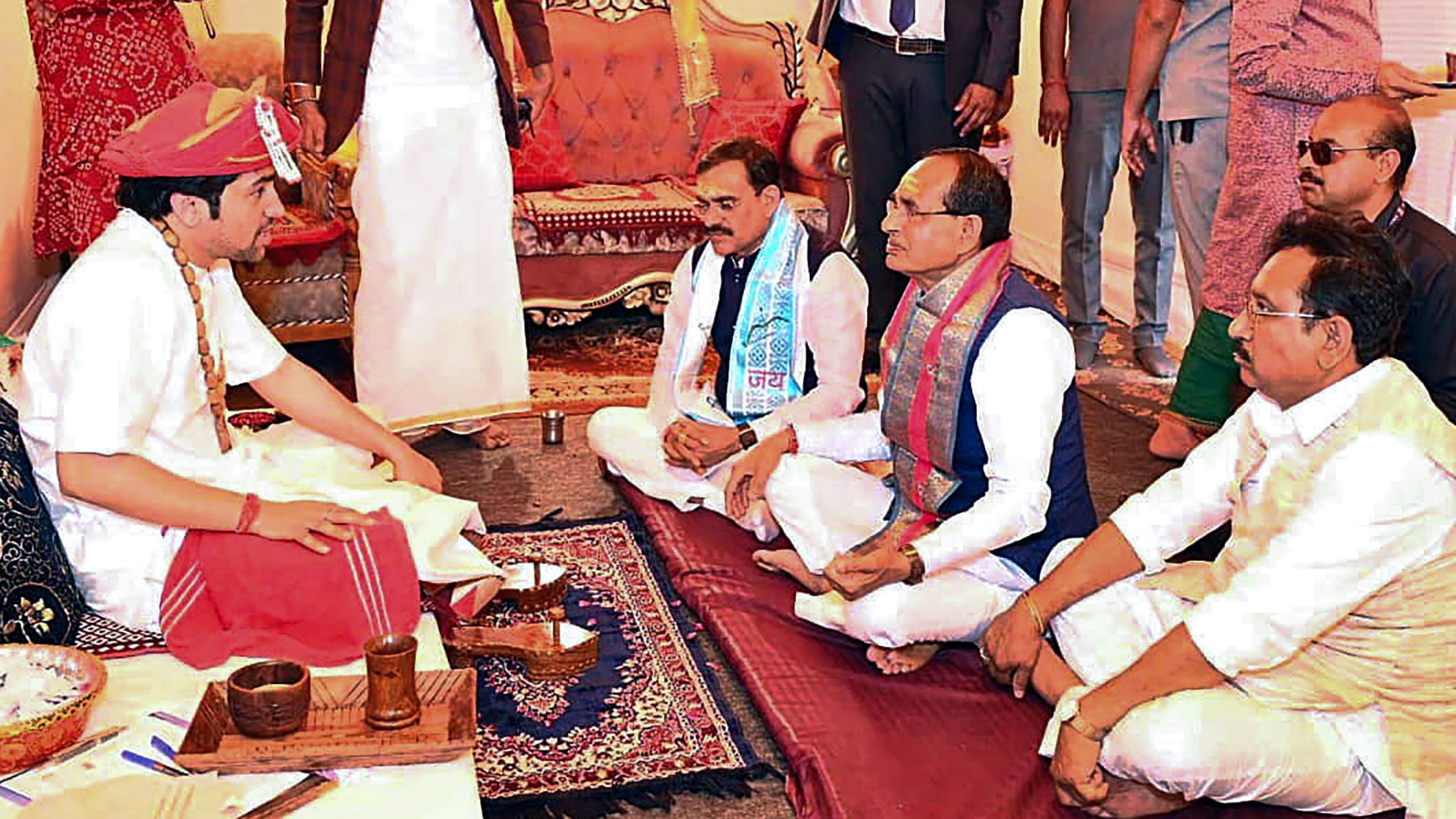 Madhya Pradesh Chief Minister Shivraj Singh Chouhan seeks blessings of self-styled Godman Dhirendra Krishna Shahstri during Hanumat Katha at Bageshwar Dham, in Chhatarpur, Saturday, Feb. 18, 2023. Credit: PTI File Photo