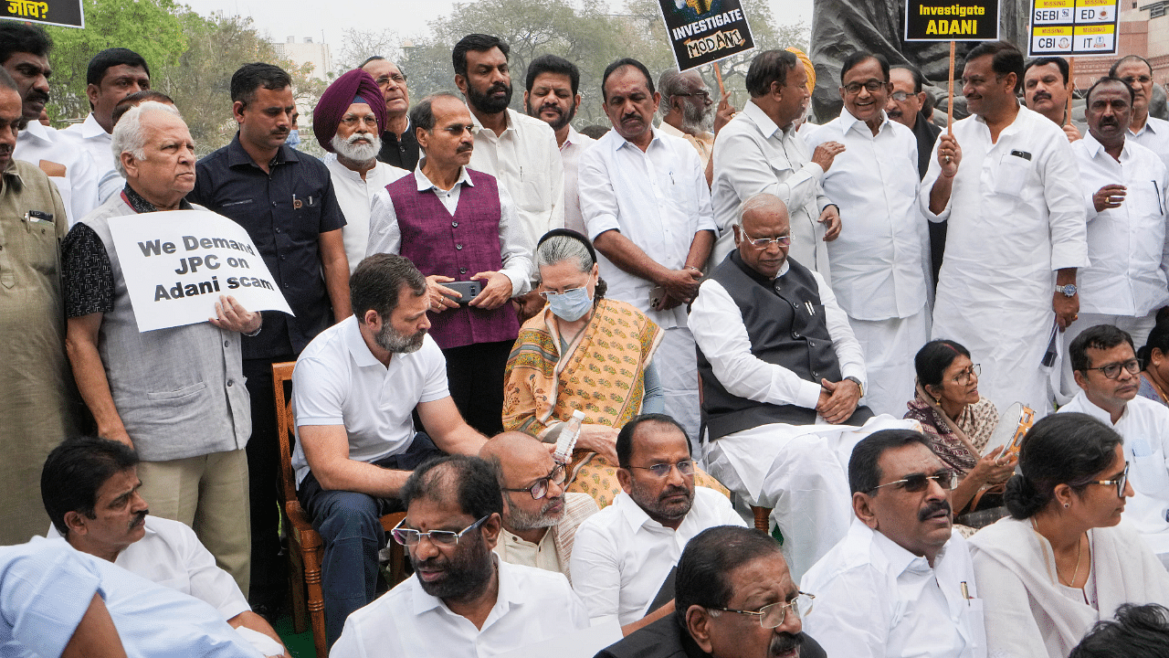 Leader of Opposition in Rajya Sabha Mallikarjun Kharge, former Congress President Sonia Gandhi, Rahul Gandhi and other opposition MPs during a protest over the Adani issue. Credit: PTI Photo