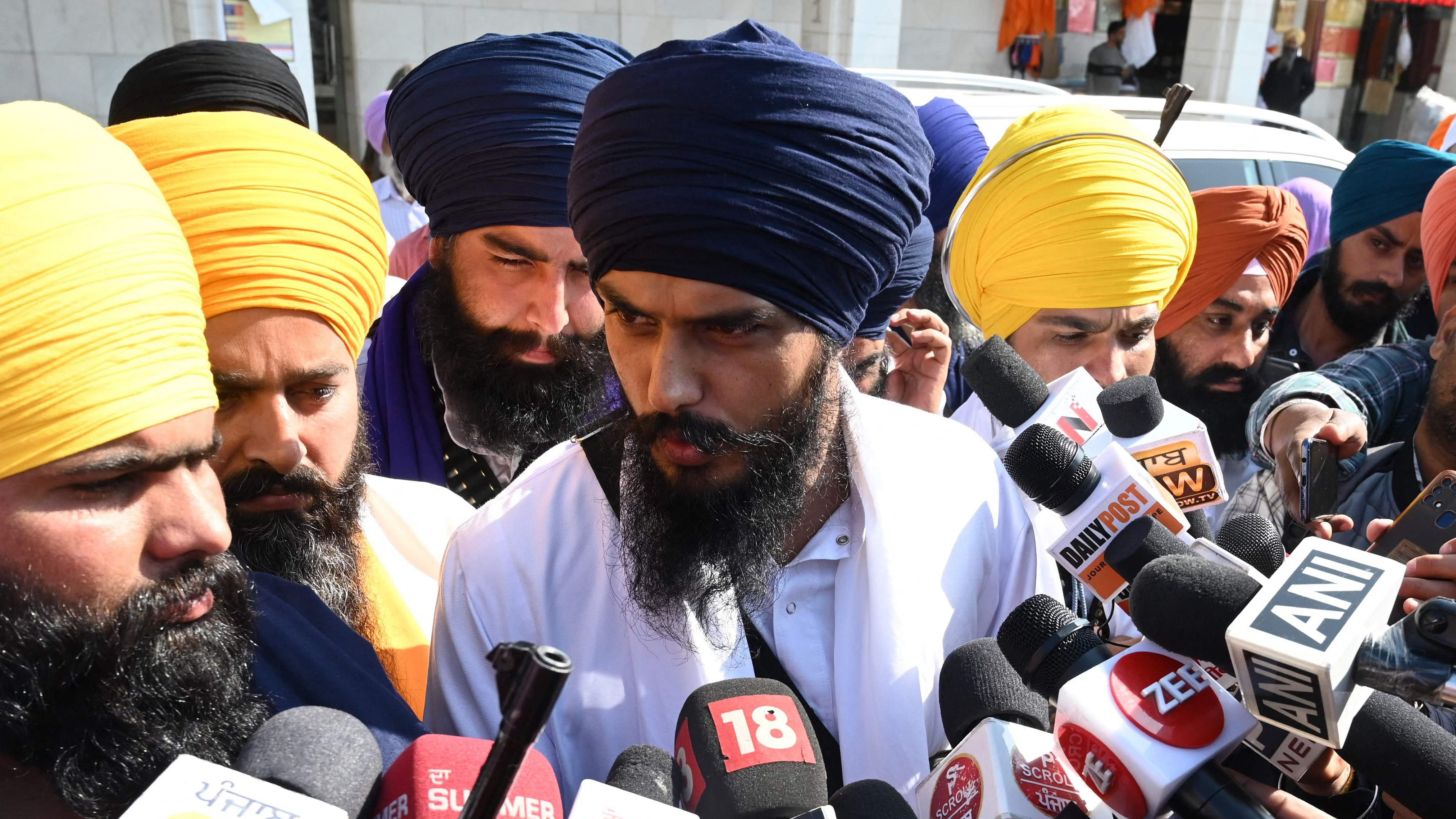 'Waris Punjab De' chief Amritpal Singh (C) speaks to the media, at the Golden Temple in Amritsar. Credit: AFP Photo