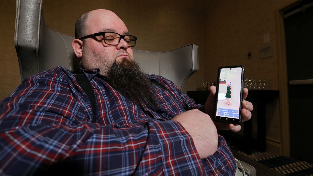 Andrew McCarroll holds his smartphone while corresponding with his Replika AI chatbot named B'Lanna, in Billings, Montana, US, March 12, 2023. Credit: Reuters Photo