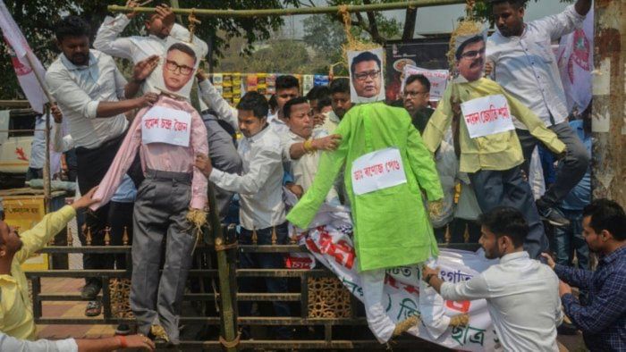 Activists of All Assam Students' Union (AASU) protest against Assam Education Minister Ranoj Pegu after the question paper leak incident. Credit: PTI Photo