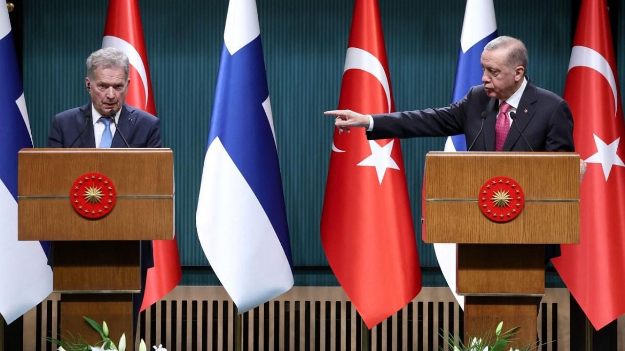 Turkish President Recep Tayyip Erdogan (R) points towards Finnish President Sauli Niinisto (L) during a joint press conference held after their meeting at the Presidential Complex in Ankara. Credit: AFP Photo