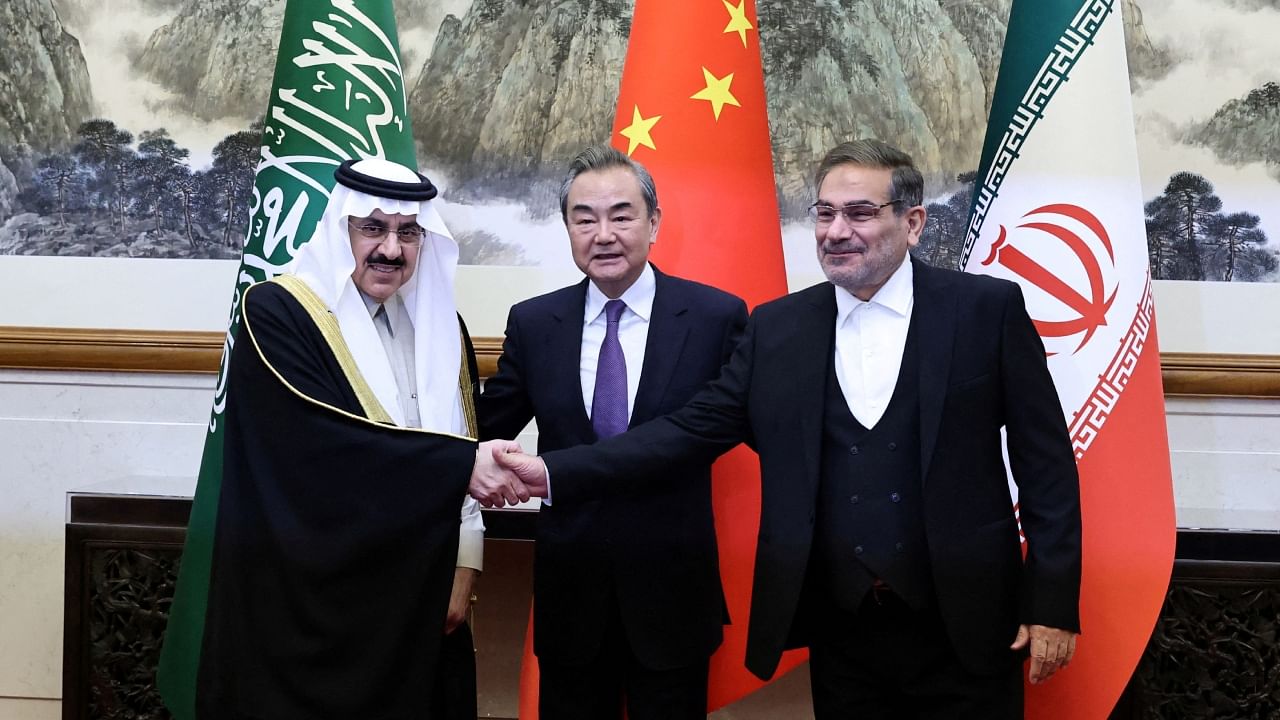 China's director of the Office of the Central Foreign Affairs Commission Wang Yi (C), Ali Shamkhani, the secretary of Iran’s Supreme National Security Council (R) and Saudi national security adviser Musaad bin Mohammed Al Aiban (L) meet in Beijing, March 10, 2023. Credit: Reuters Photo