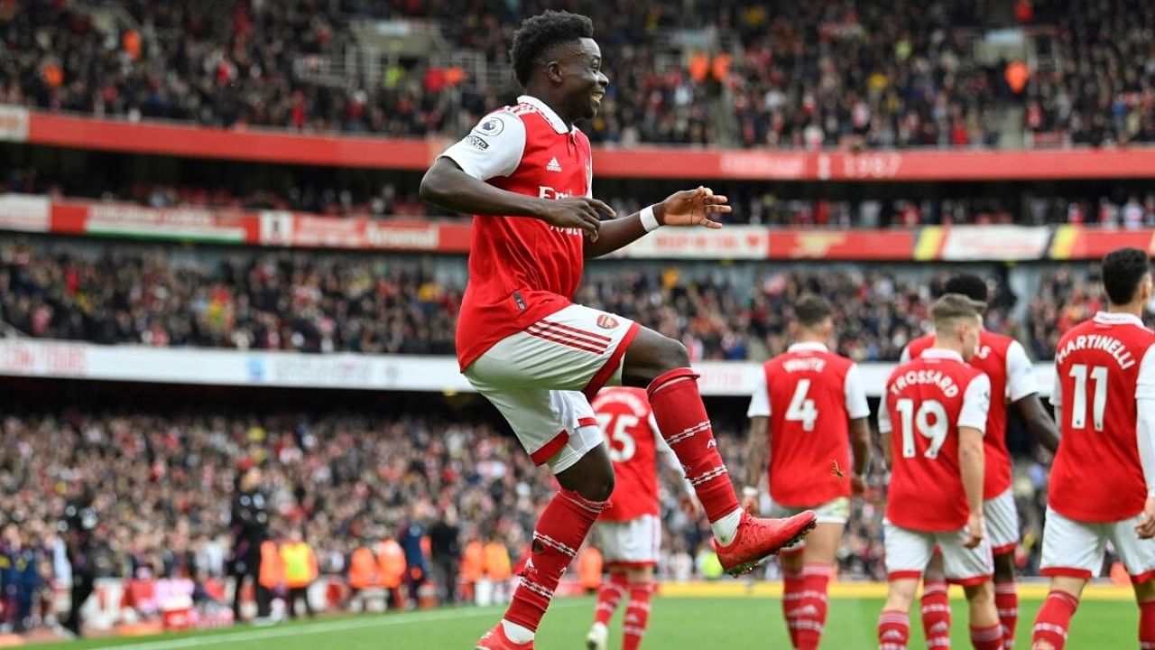 Arsenal's English midfielder Bukayo Saka celebrates after scoring their second goal during the game against Palace. Credit: AFP Photo