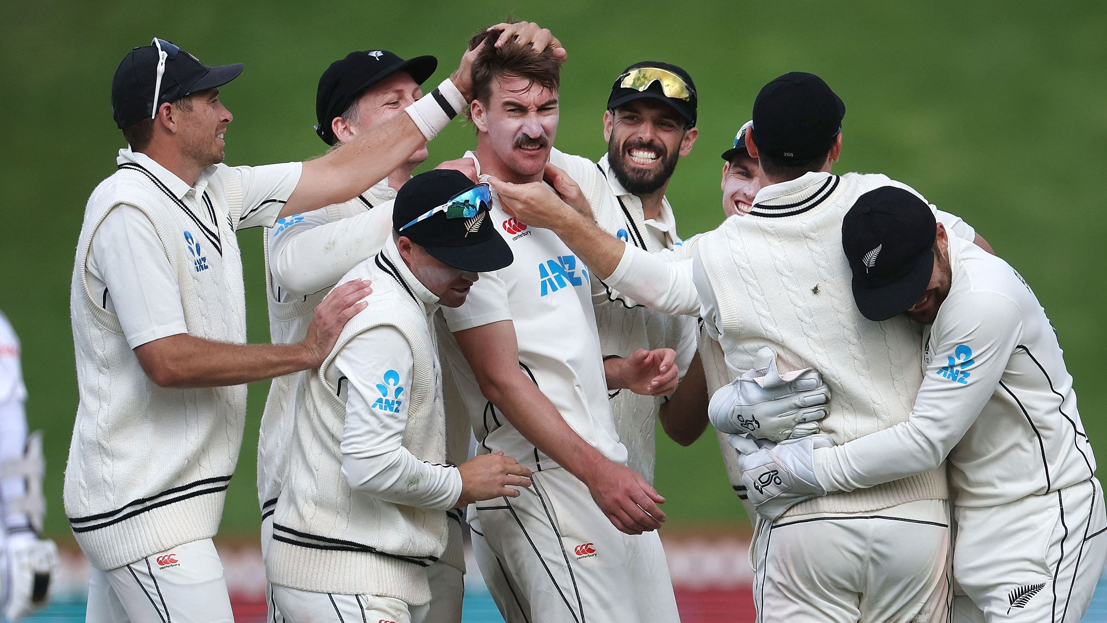 New Zealand's Blair Tickner (C) celebrates Sri Lanka's Nishan Fernando being caught with teammates during day four of the second cricket Test match between New Zealand and Sri Lanka. Credit: AFP Photo