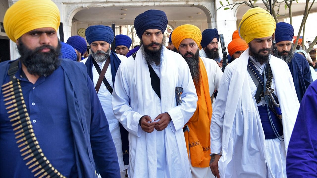 Amritpal Singh (centre) with his followers. Credit: Reuters Photo