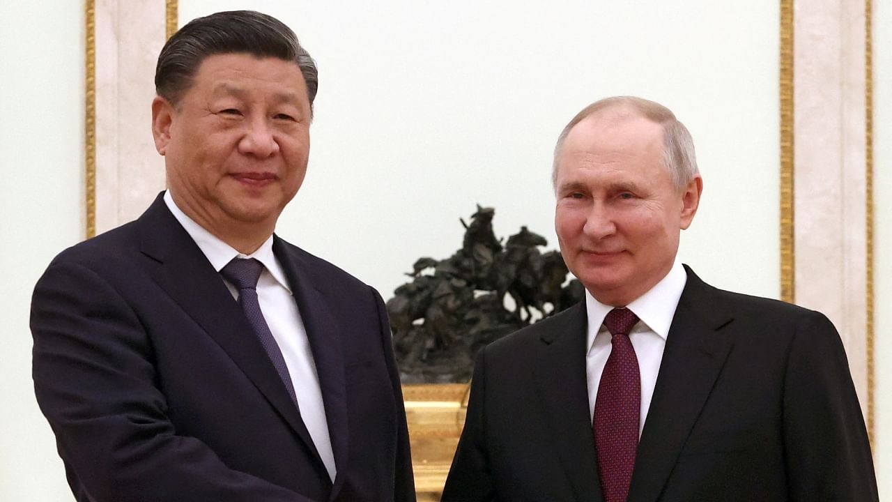Russian President Vladimir Putin shakes hands with Chinese President Xi Jinping during a meeting at the Kremlin in Moscow, Russia, March 20, 2023. Credit: Reuters/Sputnik/Sergei Karpukhin/Pool
