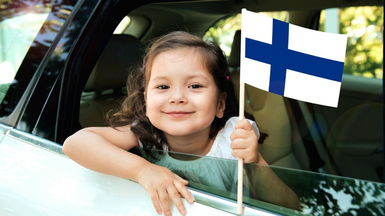 A girl holding Finnish flag. Credit: iStock Photo