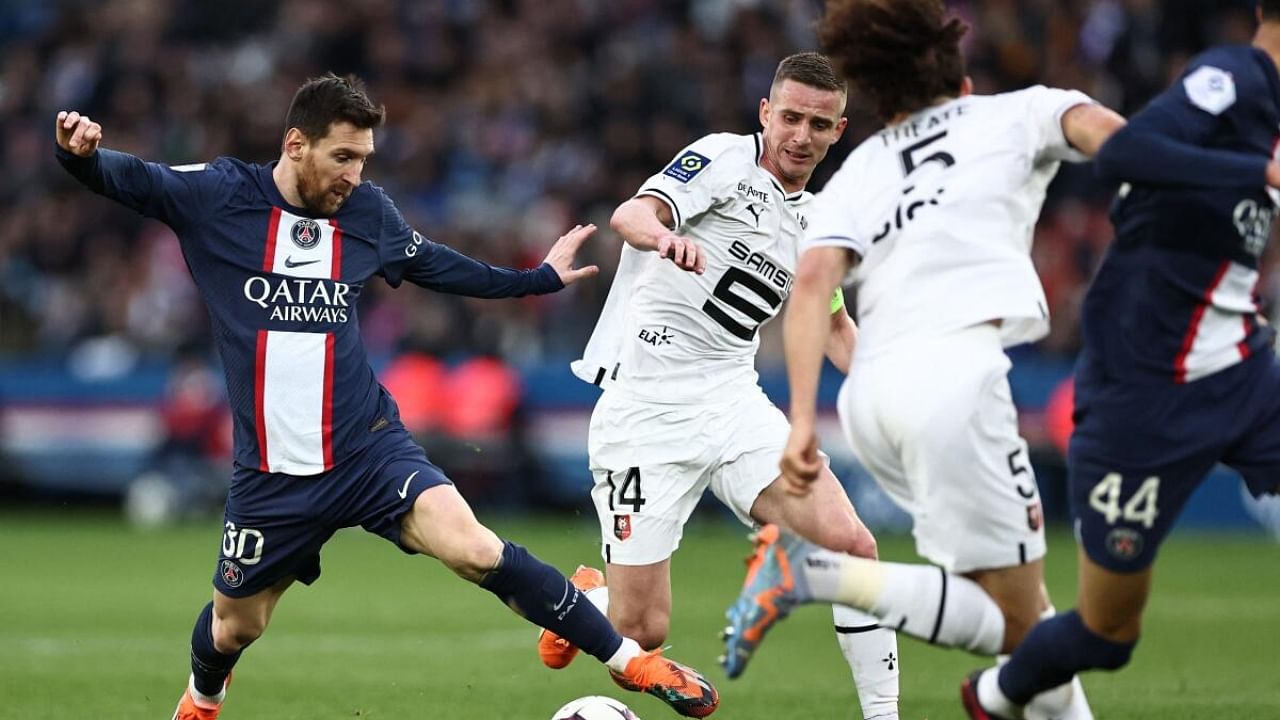 Lionel Messi (L) fights for the ball with Rennes' French midfielder Benjamin Bourigeaud (2nd-L) during the French L1 football match between Paris Saint-Germain (PSG) and Stade Rennais FC. Credit: AFP Photo