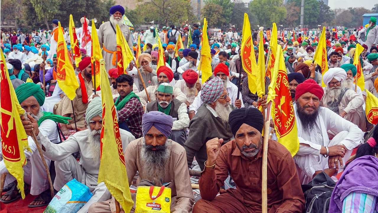 Farmers under the banner of Samyukt Kisan Morcha during 'Kisan Mahapanchayat' at Ramlila Maidan in New Delhi. Credit: PTI Photo