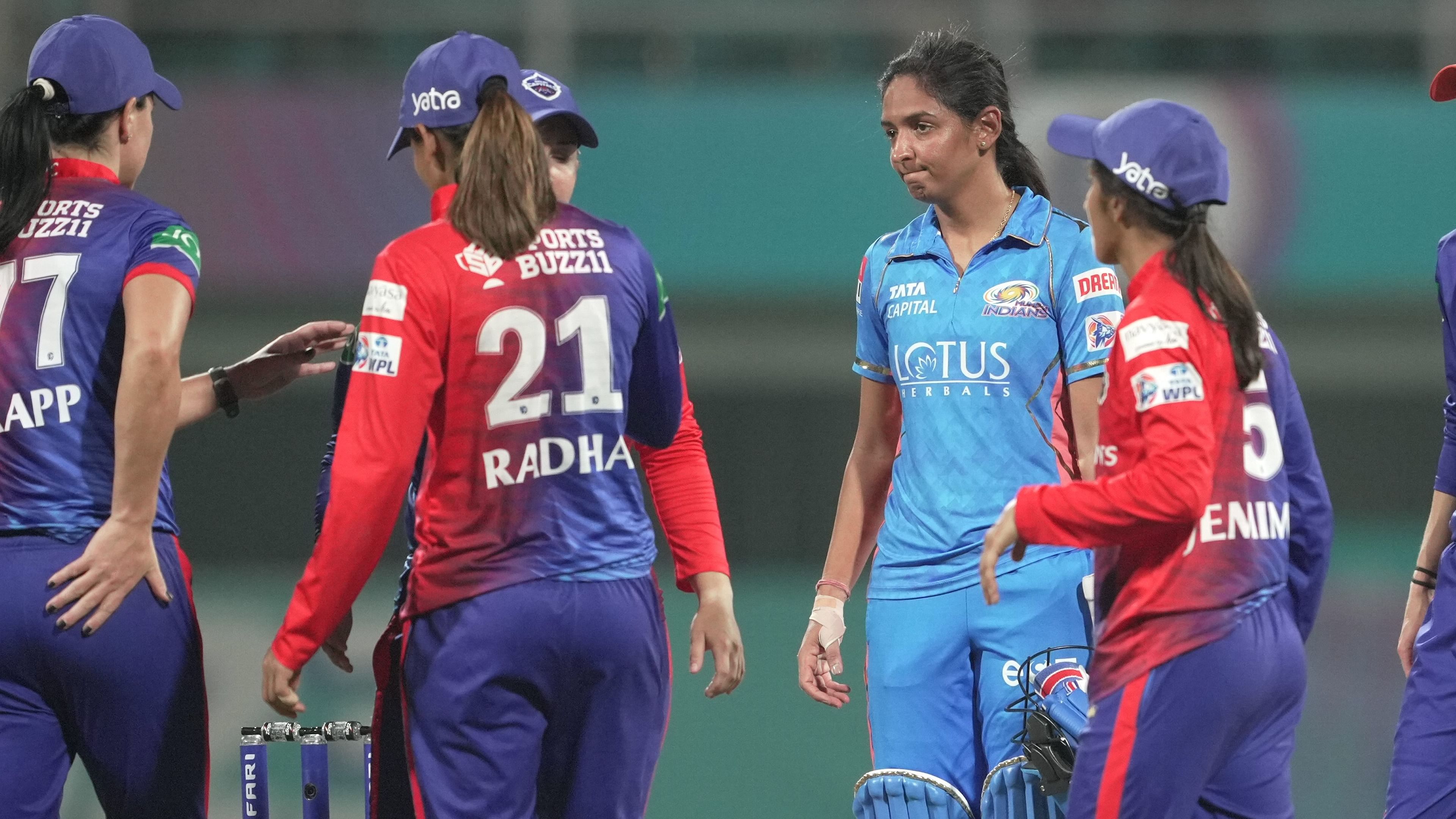 Mumbai Indians players celebrate their win in the 2023 Women's Premier League (WPL) Twenty20 cricket match between Mumbai Indians and Delhi Capitals at DY Patil Stadium in Navi Mumbai, Thursday, March 9, 2023.  Credit: PTI Photo