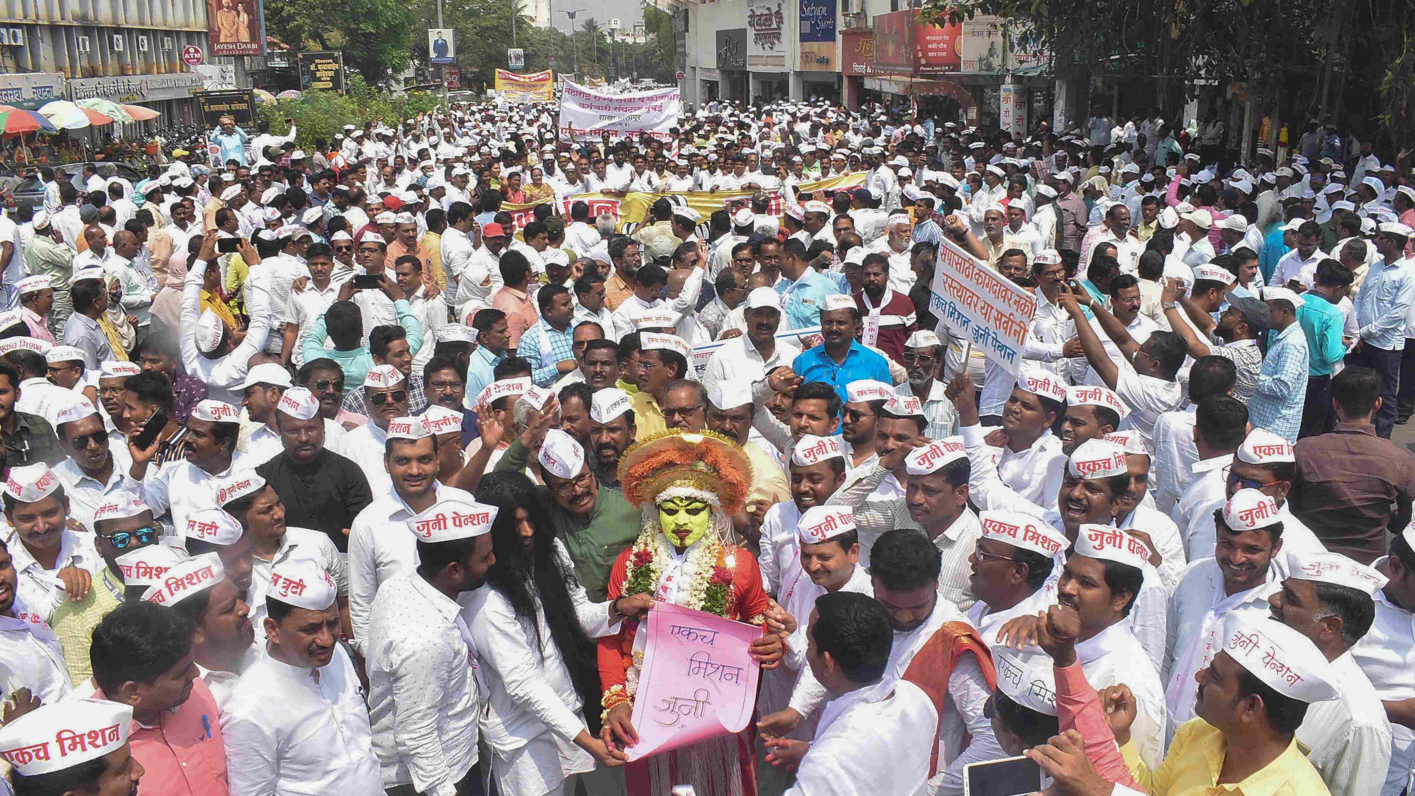 Solapur: Maharashtra government employees take part in a protest rally to demand restoration of the old pension scheme. Credit: PTI Photo