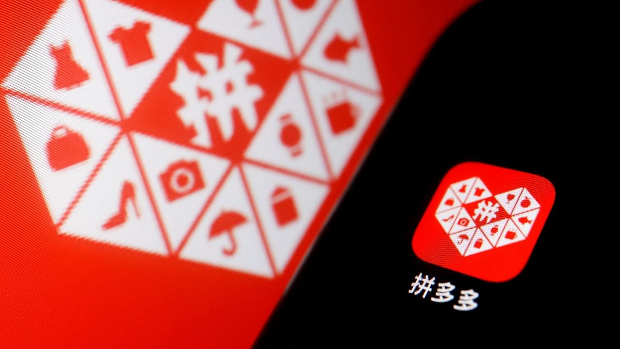 The logo of Chinese e-commerce platform Pinduoduo Inc. is displayed next to a mobile phone. Credit: Reuters Photo