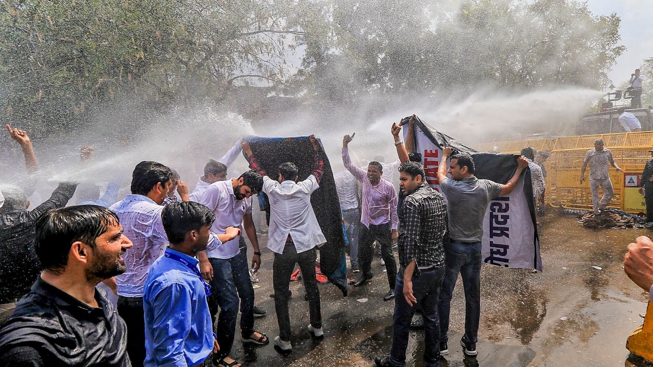 Police use water cannons to disperse doctors protesting against the Rajasthan Right to Health Bill, at Statue Circle in Jaipur, Tuesday, March 21, 2023. Credit: PTI Photo