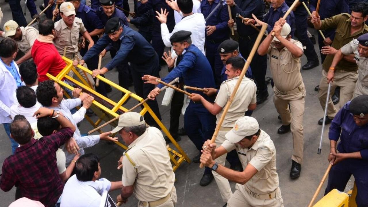 Police personnel lathicharge during a protest by doctors against Rajasthan's Right to Health Bill, at Statue Circle in Jaipur March 20,2023. Credit: IANS Photo