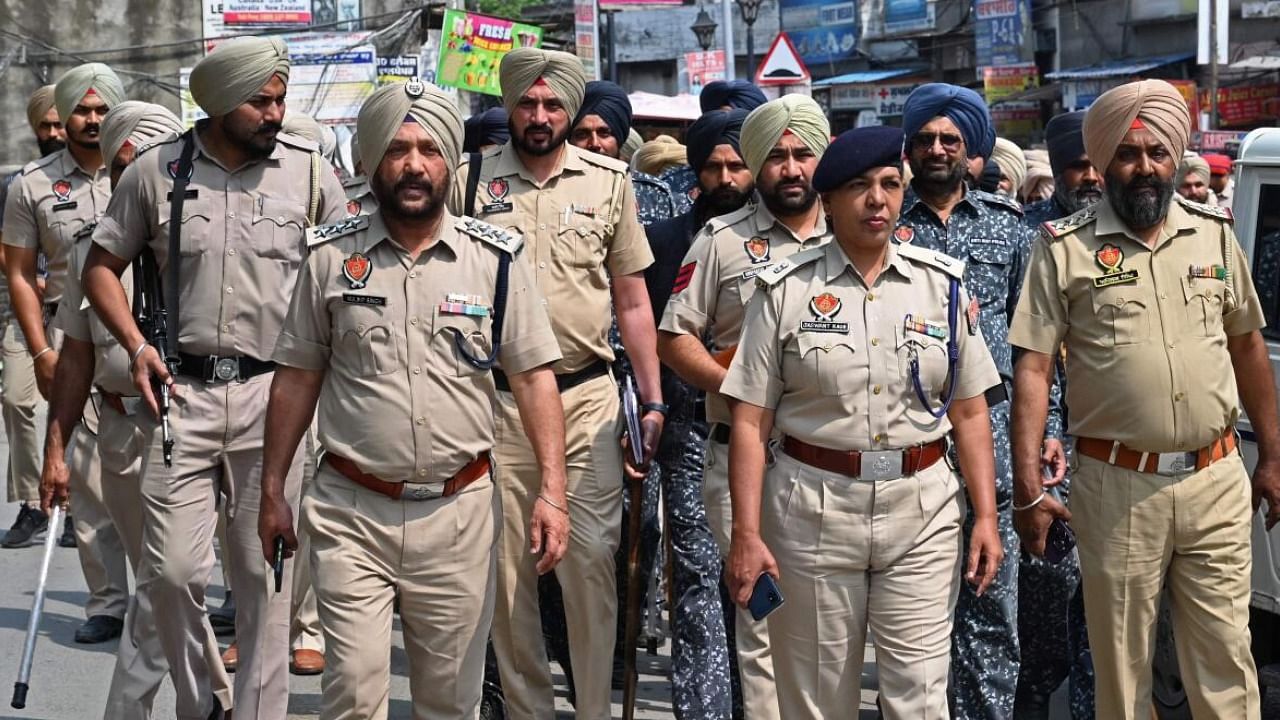 Police and security personnel patrol in the village Jallupur Khera about 45 km from Amritsar. Credit: PTI Photo