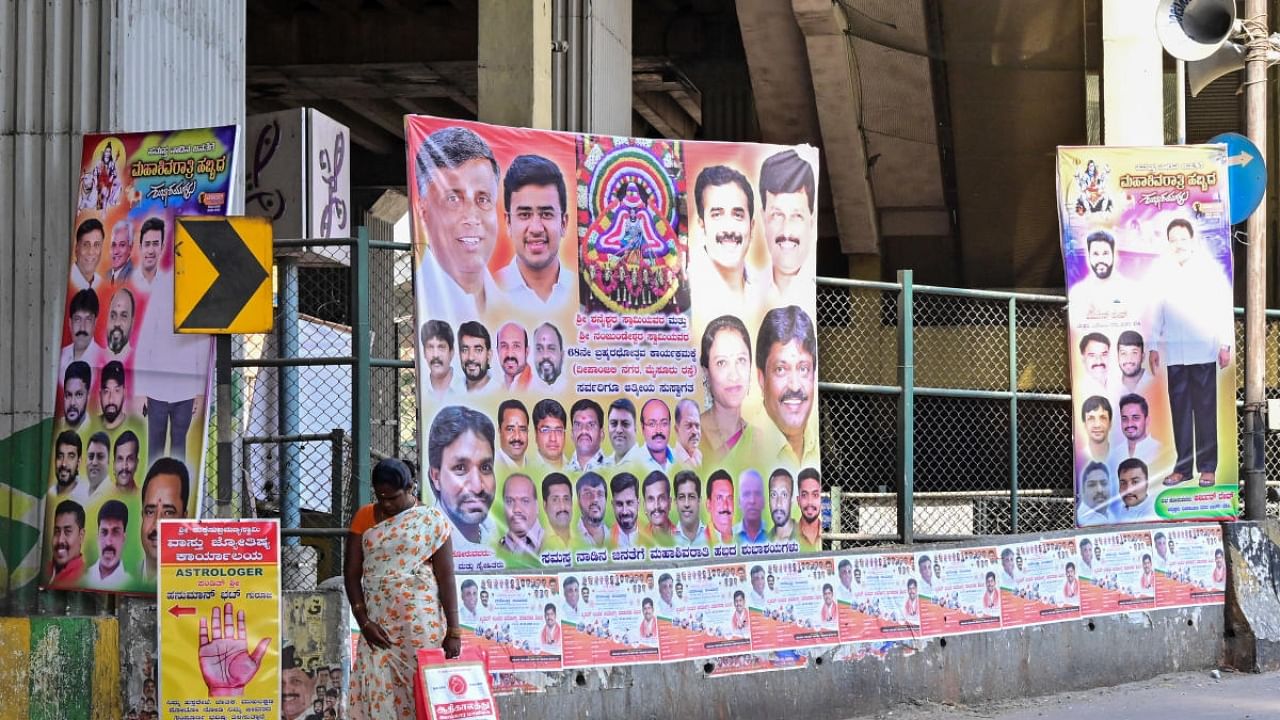 Several flexes and banners dot the roads outside the Deepanjali Nagar metro station. Credit: DH File Photo