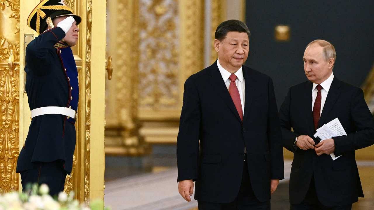 Russian President Vladimir Putin and Chinese President Xi Jinping arrive for Russia-China talks in an expanded format at the Kremlin in Moscow. Credit: Reuters Photo