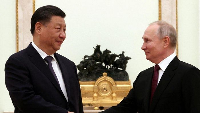 Russian President Vladimir Putin shakes hands with Chinese President Xi Jinping during a meeting at the Kremlin in Moscow, Russia, March 20, 2023. Credit: Reuters Photo 
