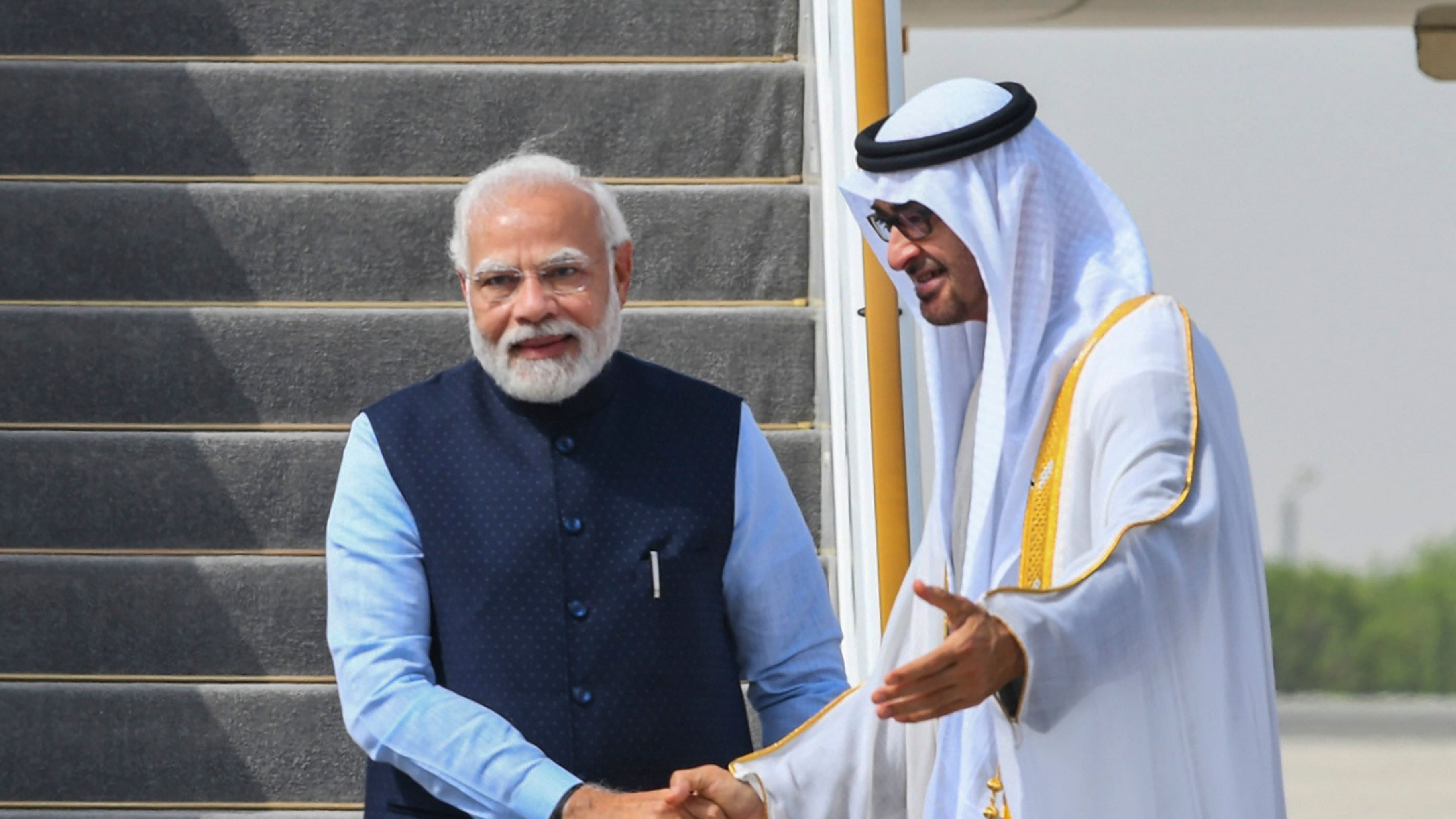 Prime Minister Narendra Modi being welcomed by President of UAE Sheikh Mohamed bin Zayed Al Nahyan upon his arrival, in Abu Dhabi. Credit: PTI Photo