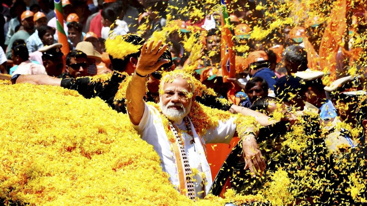 Prime Minister Narendra Modi receives a grand welcome on his arrival, in Mandya, Sunday, March 12, 2023. Credit: PTI Photo