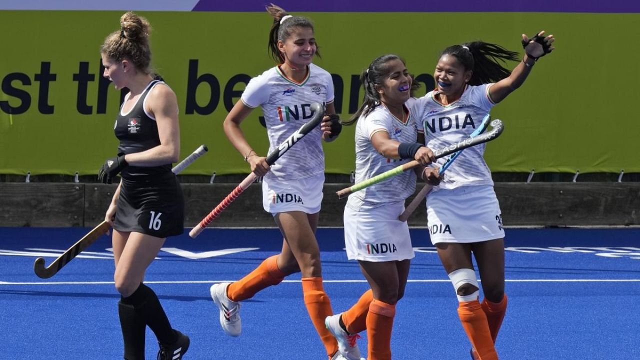 India's Tete Salima, right, celebrates with her team player after scoring a goal against Canada during the Women's Pool A hockey match at the Commonwealth Games in Birmingham, England, Wednesday, Aug. 3, 2022. Credit: AP/PTI Photo