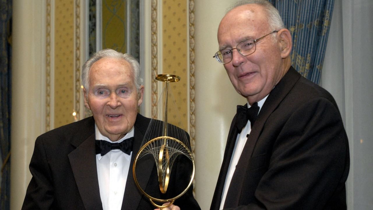 Gordon E. Moore (R), co-founder and Chairman Emeritus of Intel Corporation, receives a Marconi Society Lifetime Achievement Award. Credit: AFP Photo