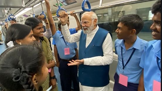 For the train journey, Modi was accompanied by a select group of Namma Metro staff and construction workers, in addition to the dignitaries. Credit: Twitter/ @BJP4India