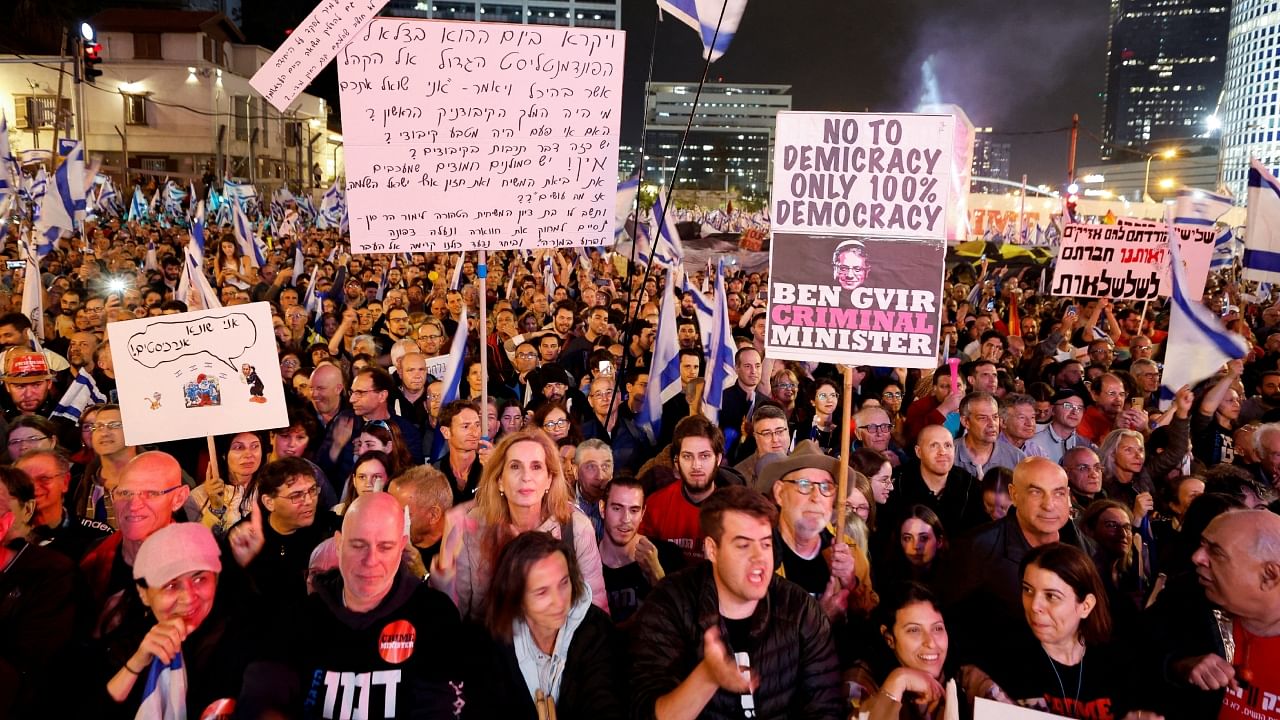 People attend a demonstration, as Israeli Prime Minister Benjamin Netanyahu's nationalist coalition government presses on with its judicial overhaul, in Tel Aviv, Israel March 25, 2023. Credit: Reuters Photo