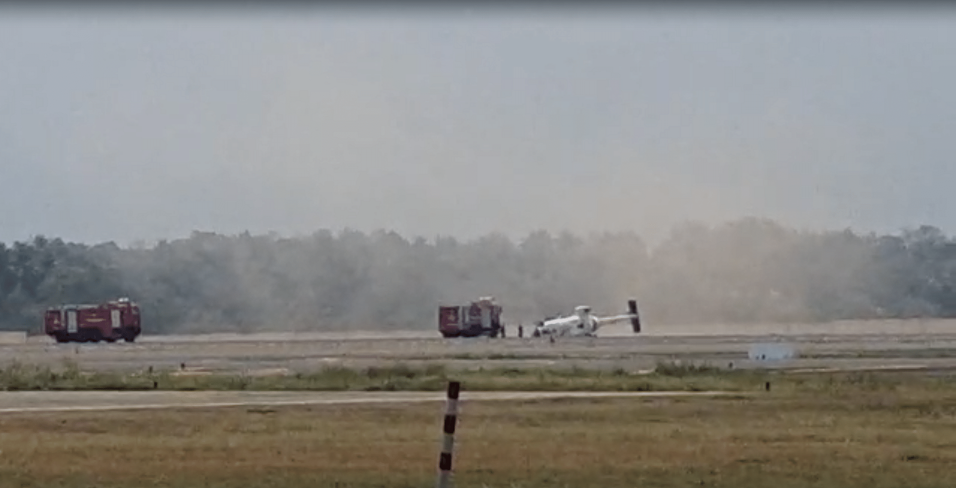 Screengrab from a video shows the crashed chopper on the runway in Kochi. Credit: Special Arrangement