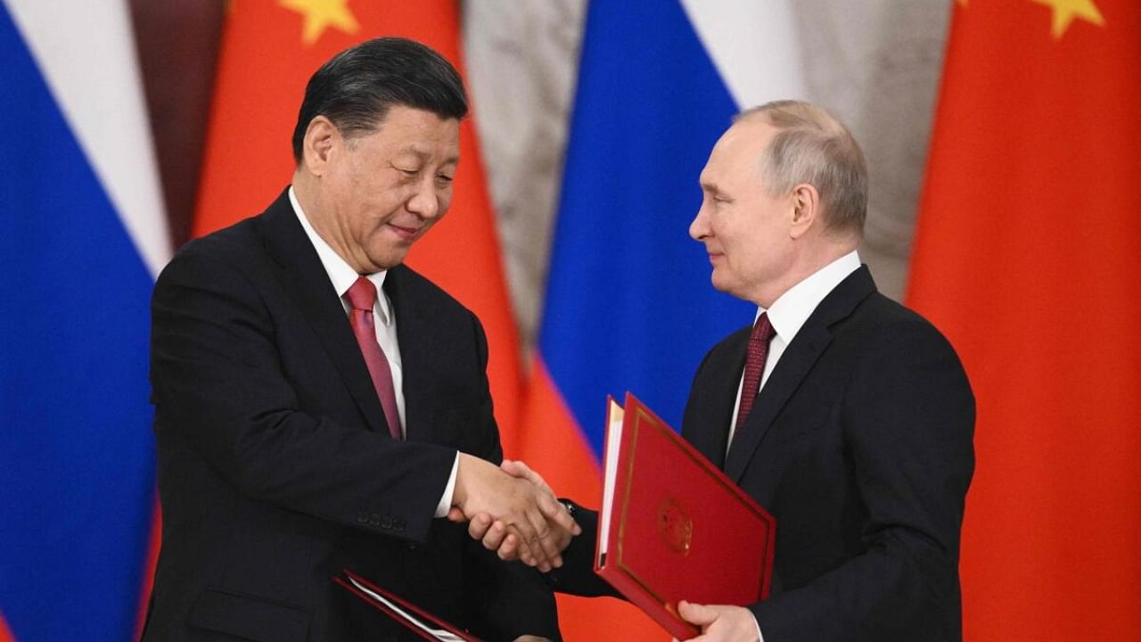 Russian President Vladimir Putin (R) and his Chinese counterpart Xi Jinping. Credit: AFP Photo