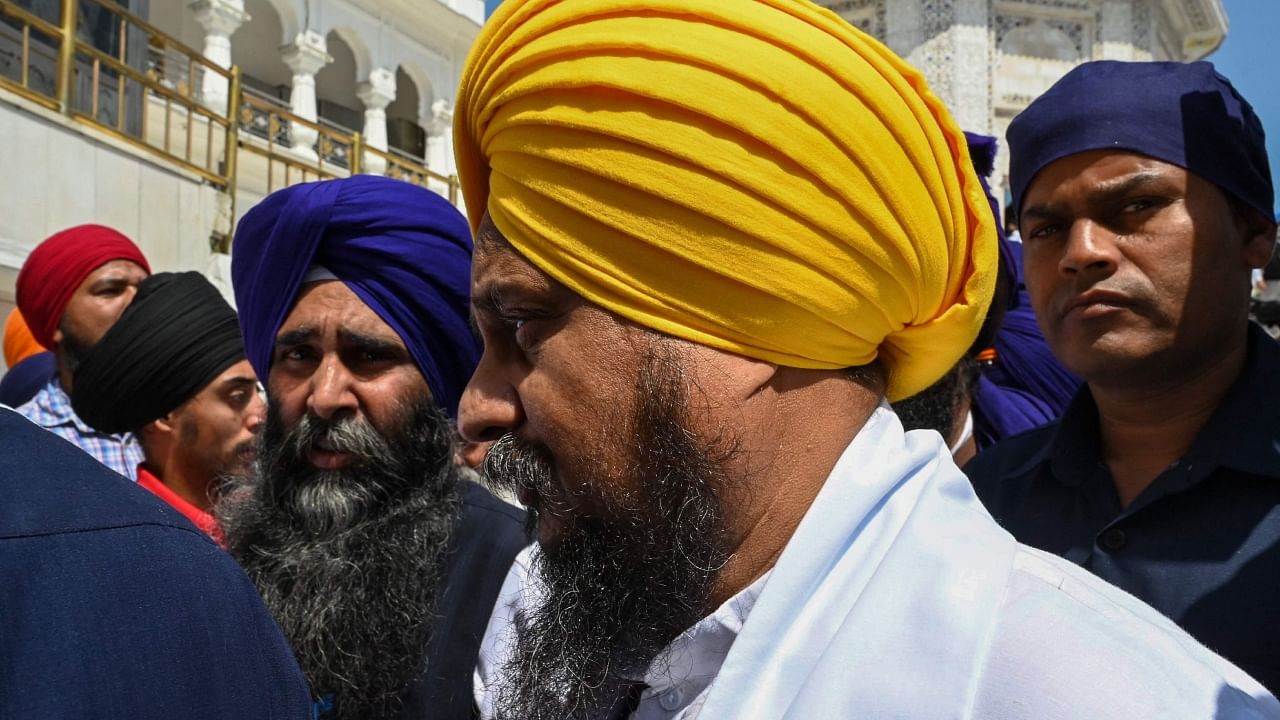 The Jathedar (head priest) of the Akal Takht (seat of authority for Sikhs) Giani Harpreet Singh (C) arrives to attend a special meeting Punjab's prevailing situation, at the Golden Temple in Amritsar on March 27, 2023. Credit: AFP Photo