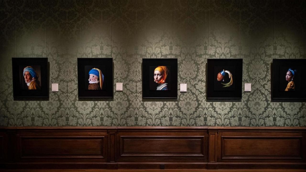The Mauritshuis Museum in Netherlands sparked controversy by displaying an AI-generated image inspired by Vermeer's 'Girl With a Pearl Earring'. Credit: AFP