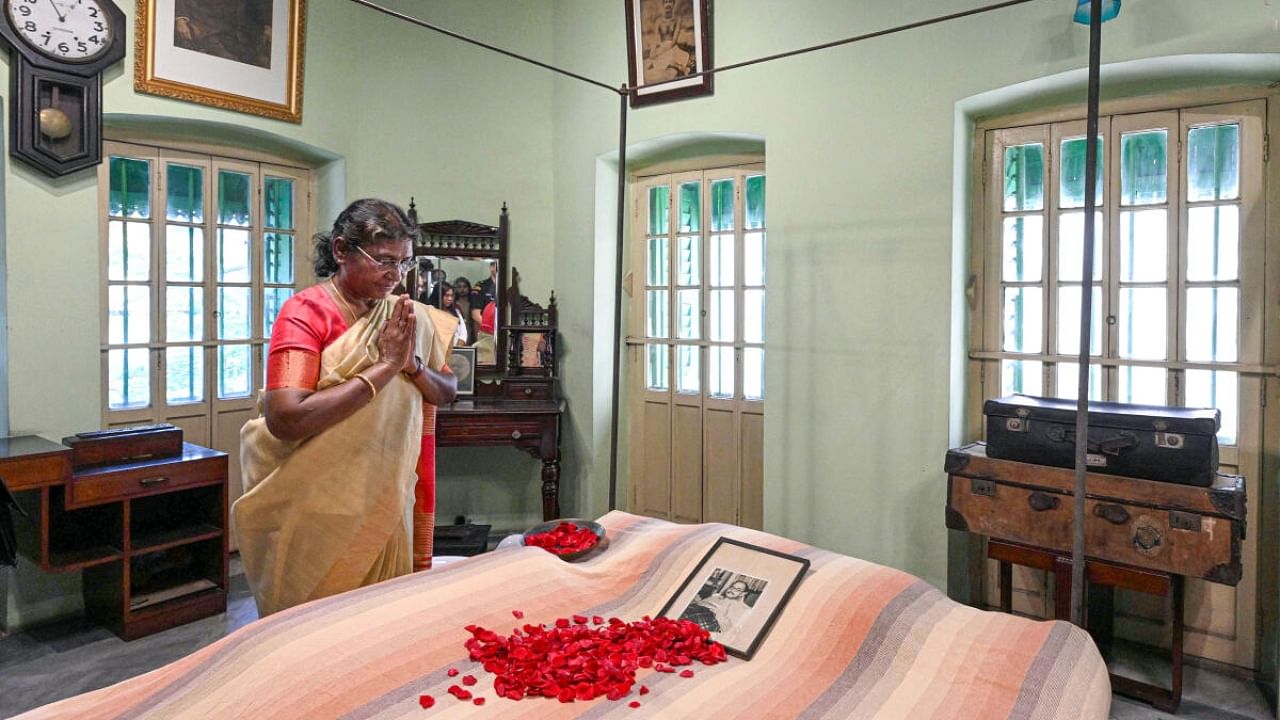 President Droupadi Murmu pays tribute to Netaji Subhas Chandra Bose during a visit to Netaji Bhawan in Kolkata. Credit: PTI Photo