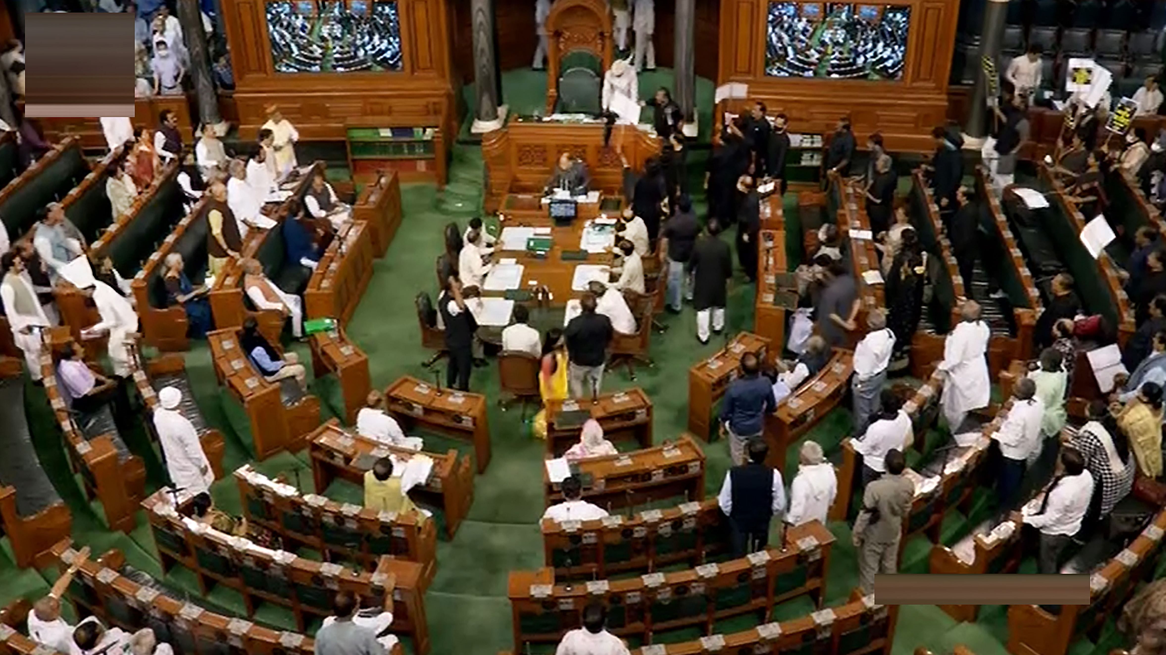 Opposition MPs, wearing black over the disqualification of Congress leader Rahul Gandhi from Lok Sabha, protest in the well of the House during Budget Session of Parliament. Credit: PTI Photo