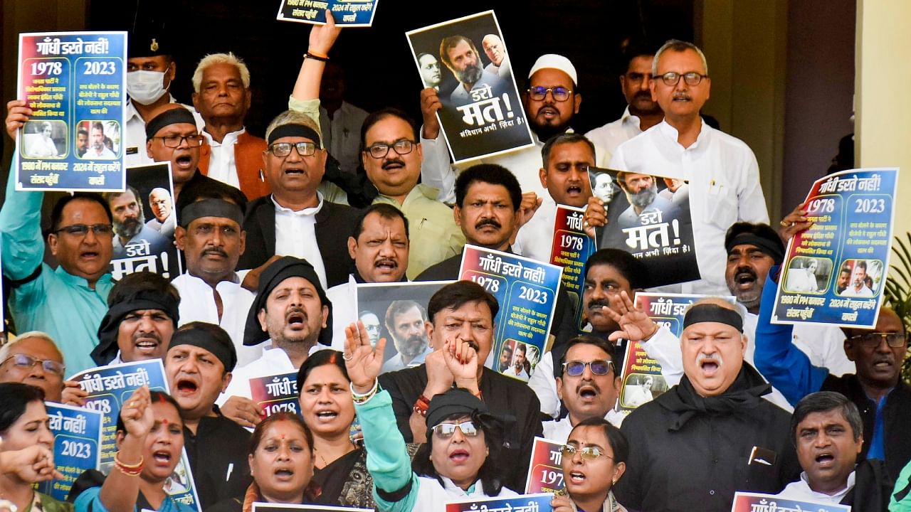 Mahagathbandhan legislators stage a protest over disqualification of Congress leader Rahul Gandhi from the Lok Sabha, during the Budget Session of Bihar Assembly, in Patna, March 27, 2023. Credit: PTI Photo