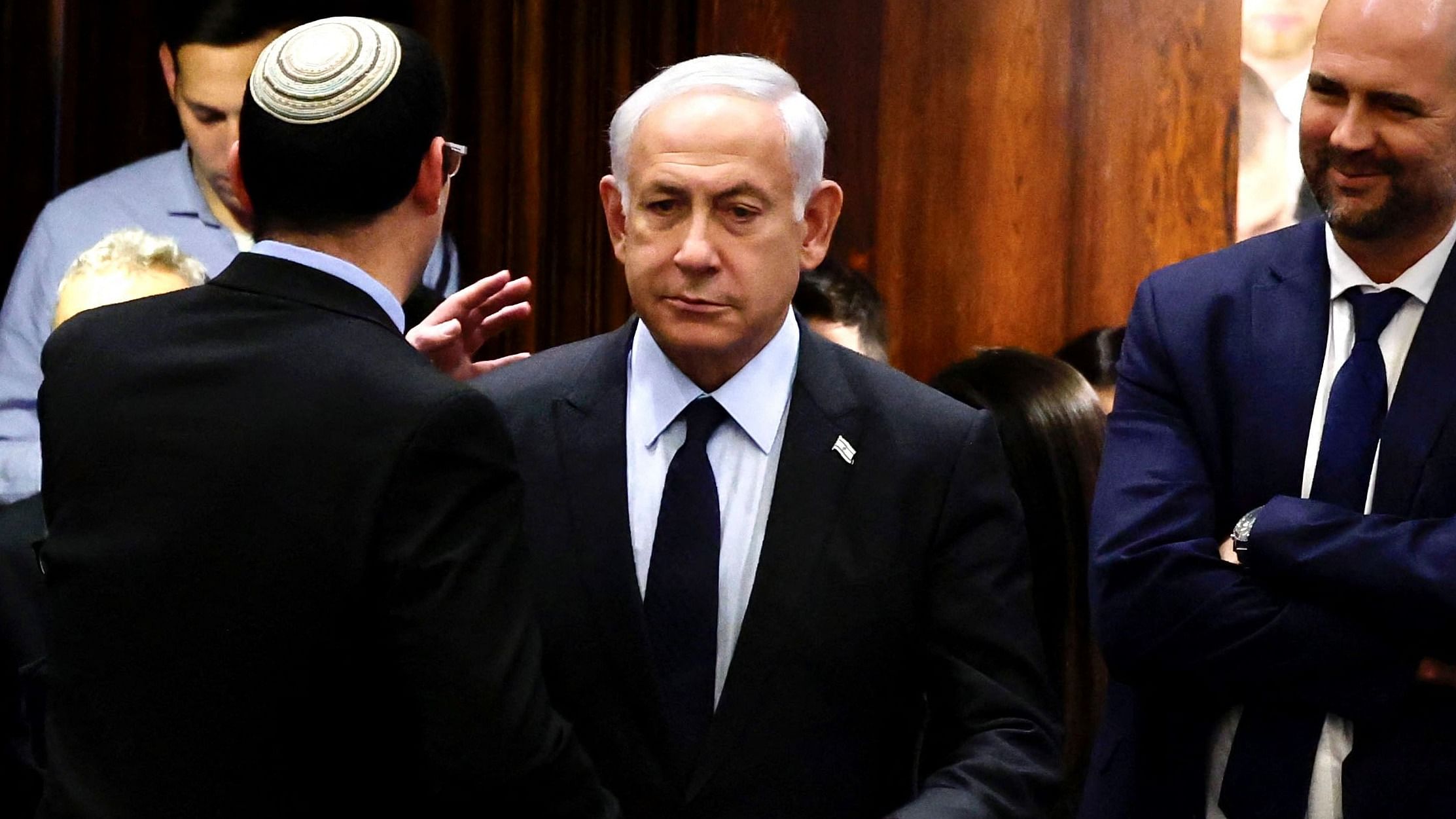 Israeli Prime Minister Benjamin Netanyahu (C) stands at the Knesset, Israel's parliament in Jerusalem. Credit: AFP Photo