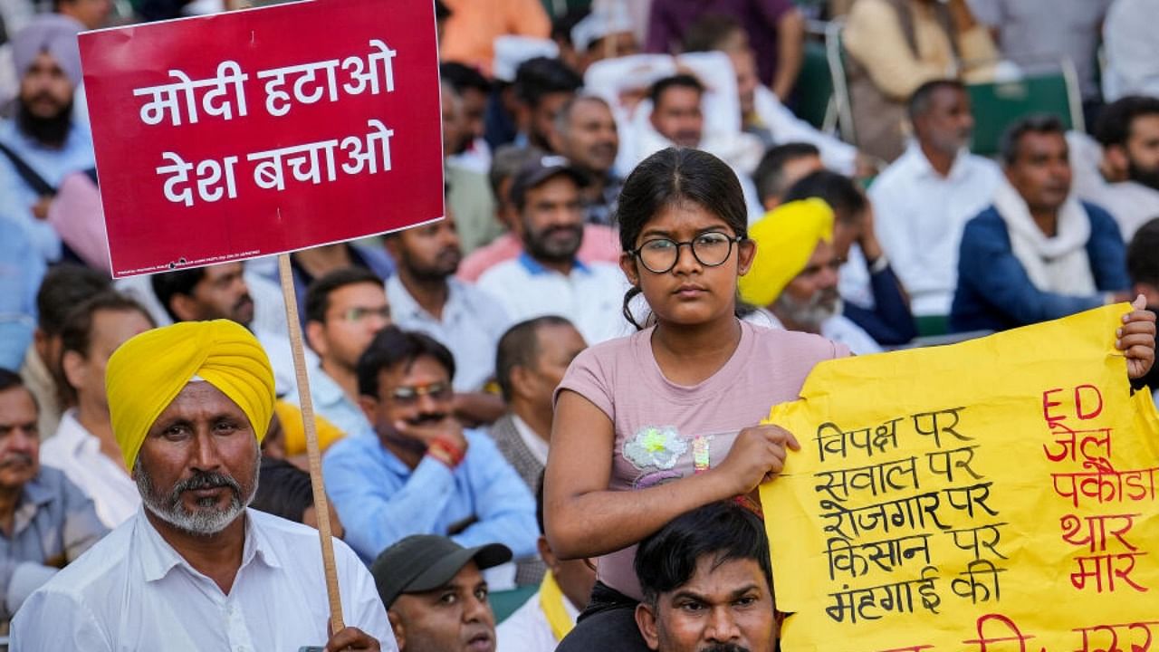 AAP supporters during a public meeting of Delhi Chief Minister Arvind Kejriwal at Jantar Mantar, in New Delhi, Thursday, March 23, 2023. Credit: PTI Photo