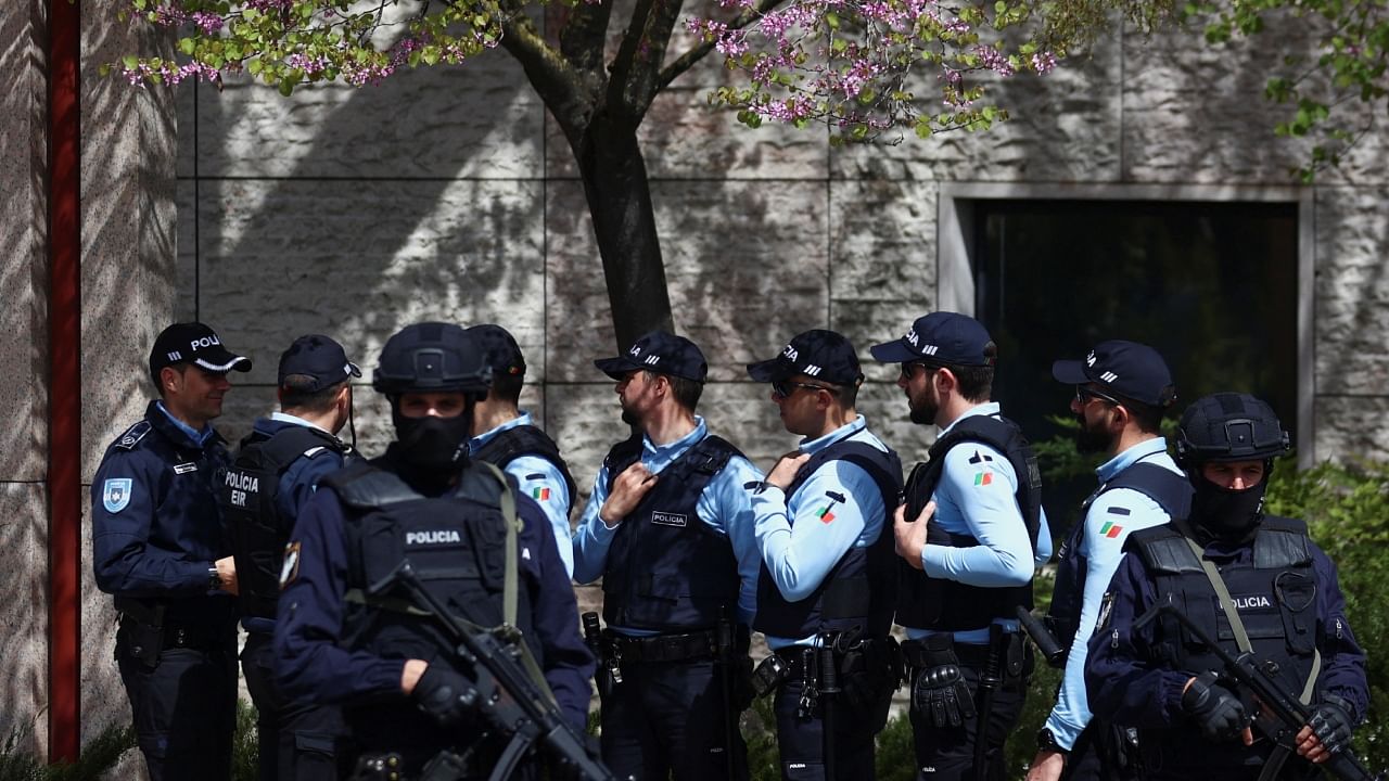 Police officers stand guard outside Ismaili Centre, after a deadly knife attack in Lisbon, Portugal, March 28, 2023. Credit: Reuters Photo