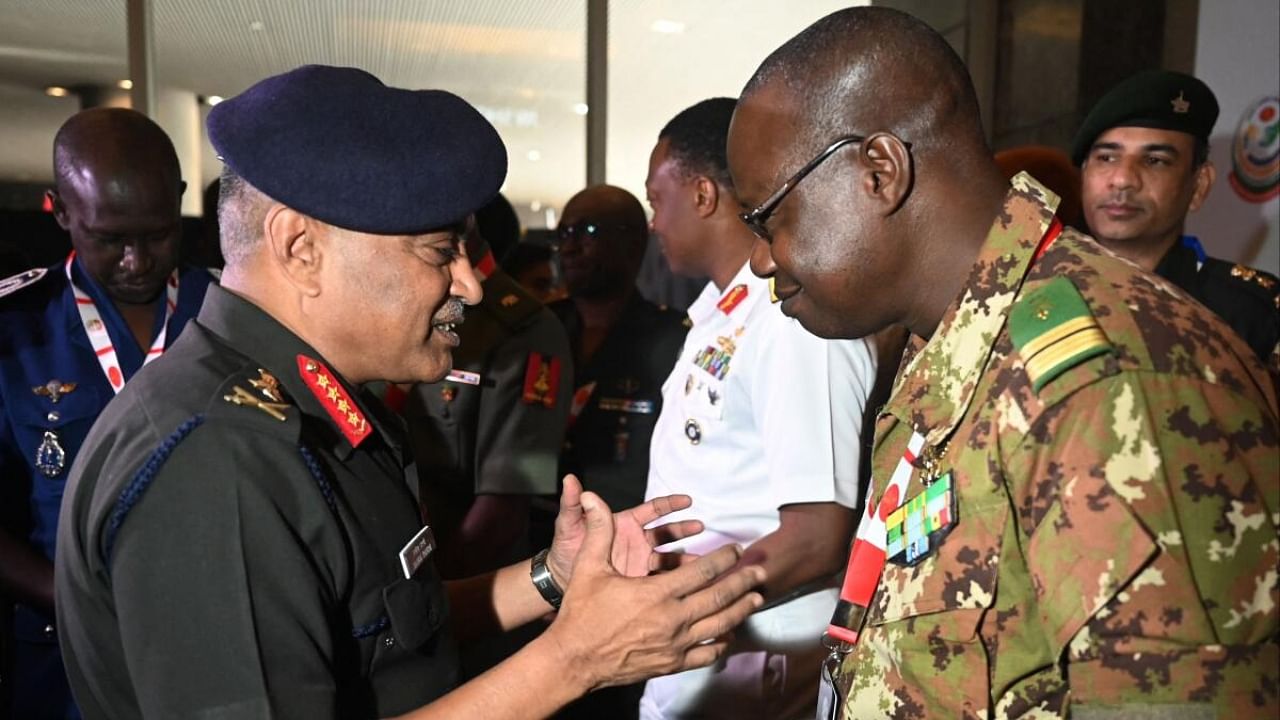 Chief of Indian Army Staff General Manoj Pande (L) speaks with a delegate during the India-Africa Army Chief’s conclave in Pune. Credit: AFP Photo