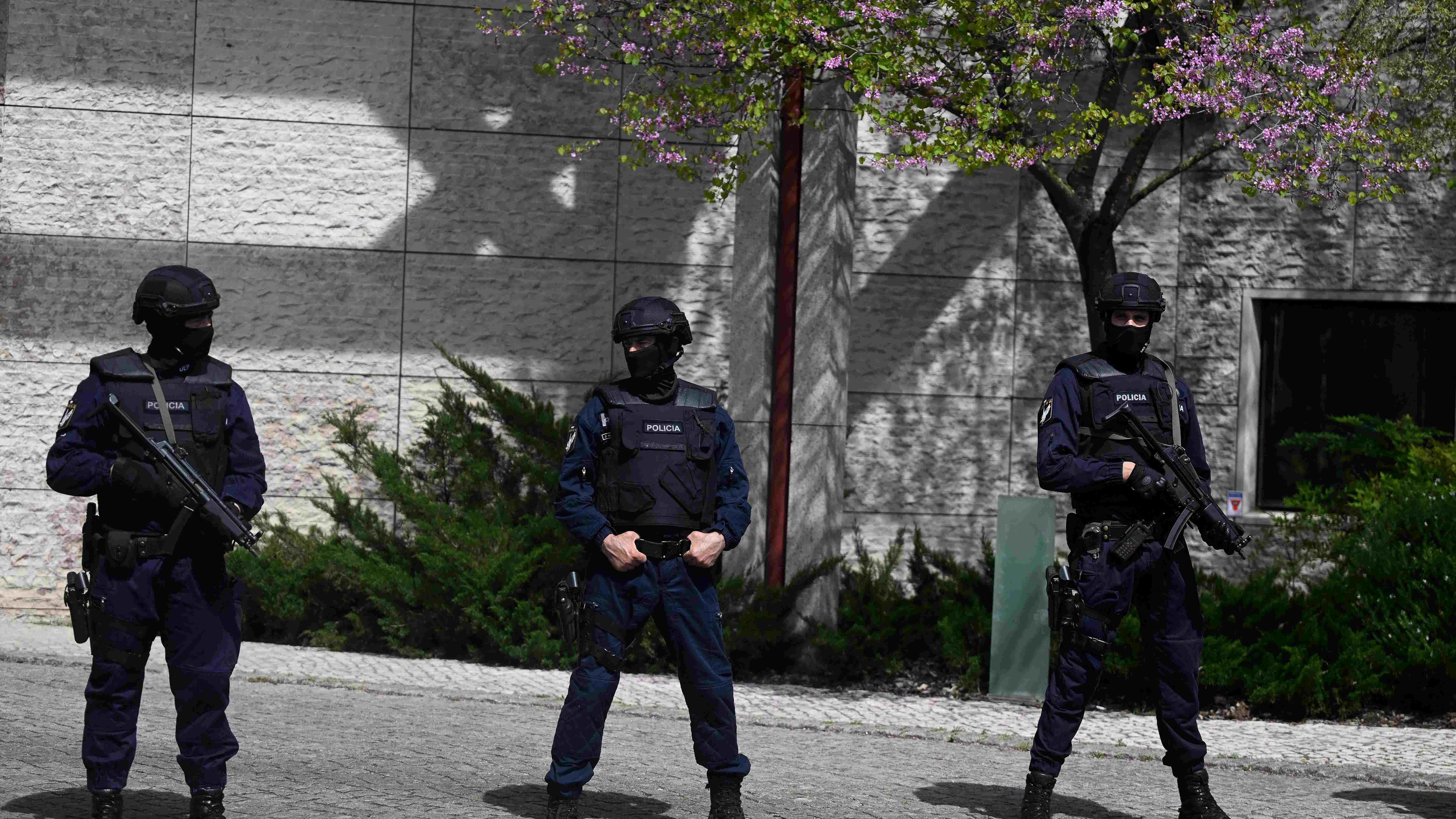 Portuguese police officers stand guard in front of the Ismaili Islamic centre in Lisbon, after two people died following a knife attack that wounded several others, on March 28, 2023. - "The attack left several people wounded and, for the moment, two dead," said police, adding that the suspected assailant had been arrested. Credit: AFP Photo