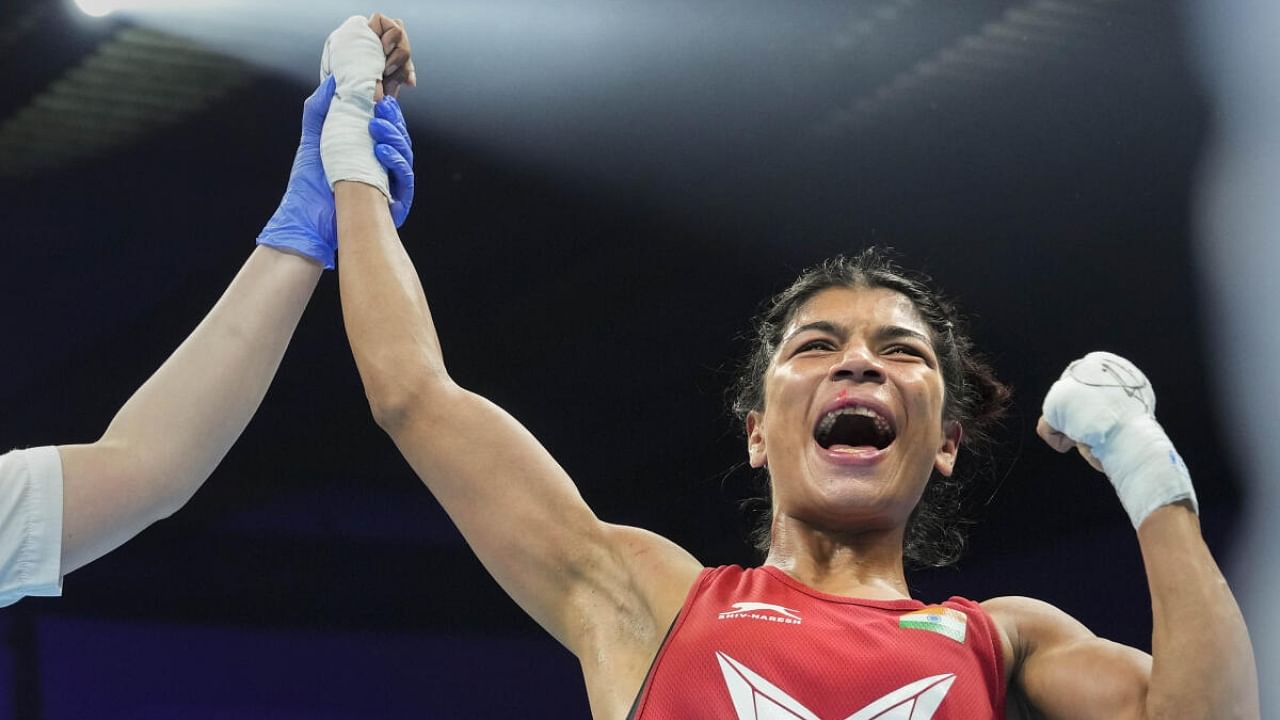 Nikhat Zareen being declared as winner against Vietnam’s Nguyen Thi Tam in 50 kg finals at the 2023 IBA Women’s Boxing World Championships. Credit: PTI Photo