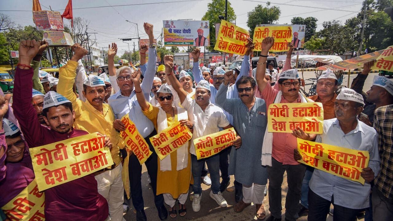 AAP workers raise slogans during a protest against the central government, outside the BJP office in Patna. Credit: PTI Photo
