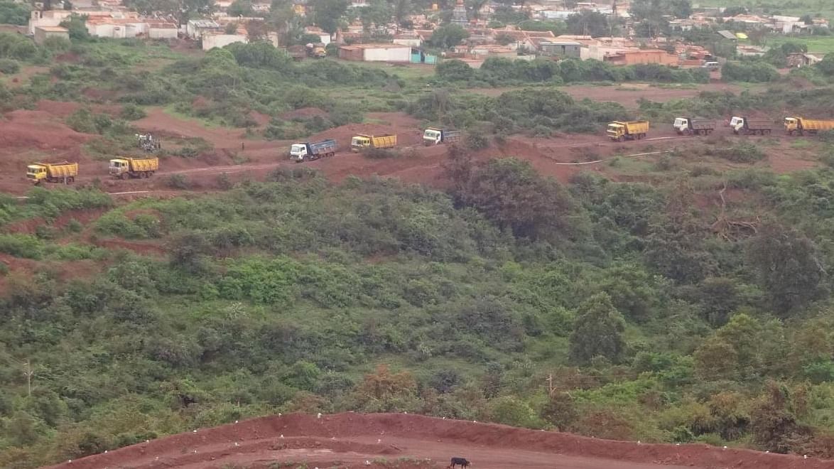 An aerial view of iron ore mine at Devagirihalli in Sandur taluk. The illegal mining has ceased to exist, but fortunes made during the peak of illegal extraction and transportation of ore continue to muddy the politics of Ballari and Vijaynagara districts. Credit: Special Arrangement