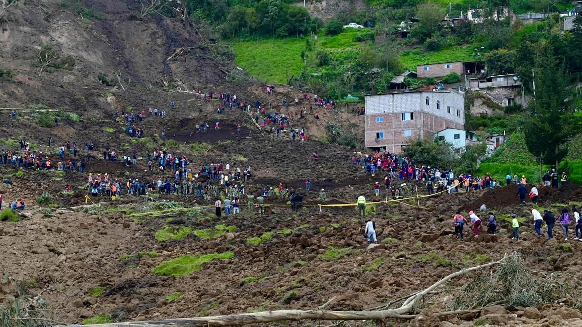Residents abandon their homes after a landslide in Alausi, Ecuador on March 28, 2023. Credit: AFP Photo