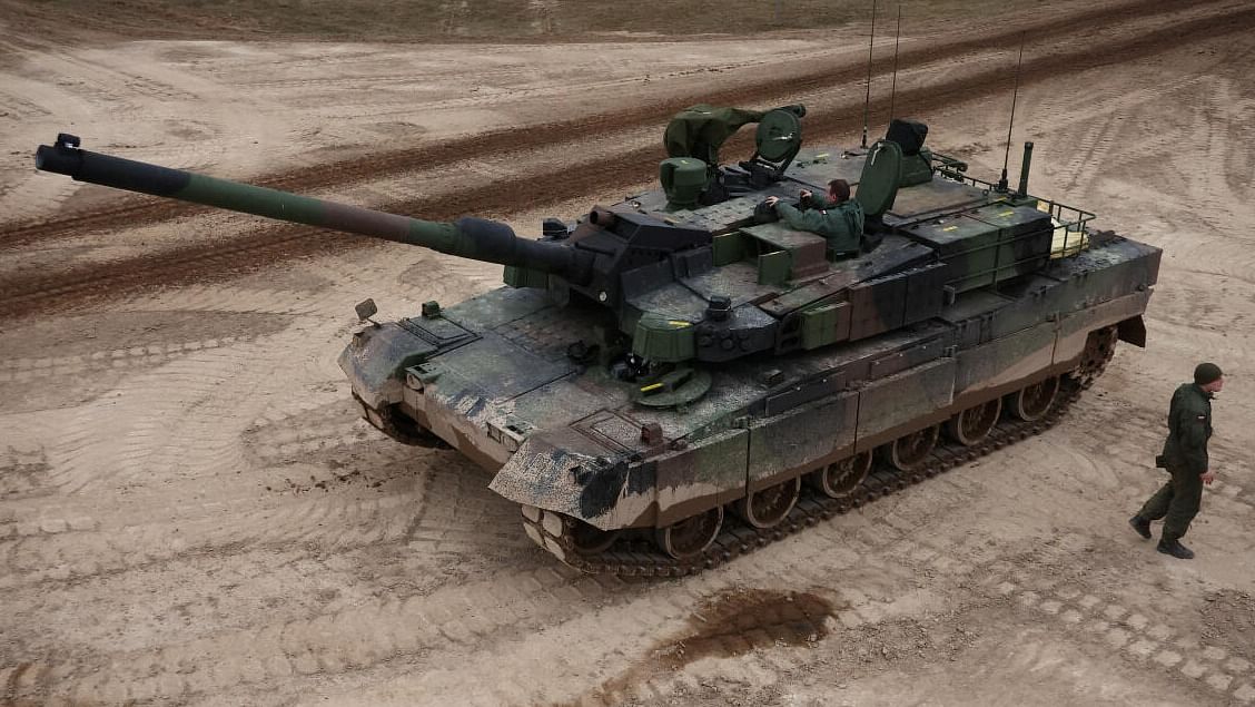 Polish soldiers are seen near a K2 tank, delivered in the first batch of arms from South Korea under contracts signed in recent months, during a military drill at a military range in Wierzbiny near Orzysz, Poland, March 30, 2023.  Credit: Reuters Photo