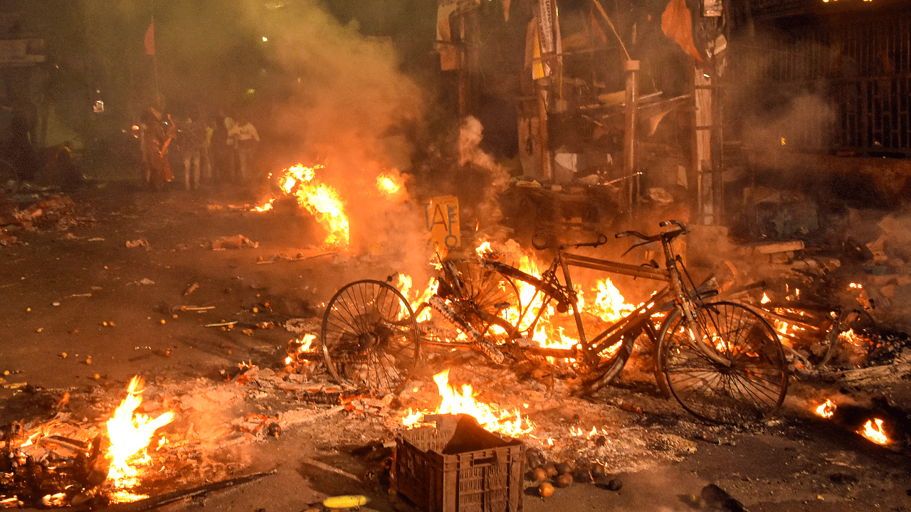 Vehicles set on fire by miscreants during clashes between two groups, at Kajipara in Howrah district. Credit: PTI Photo
