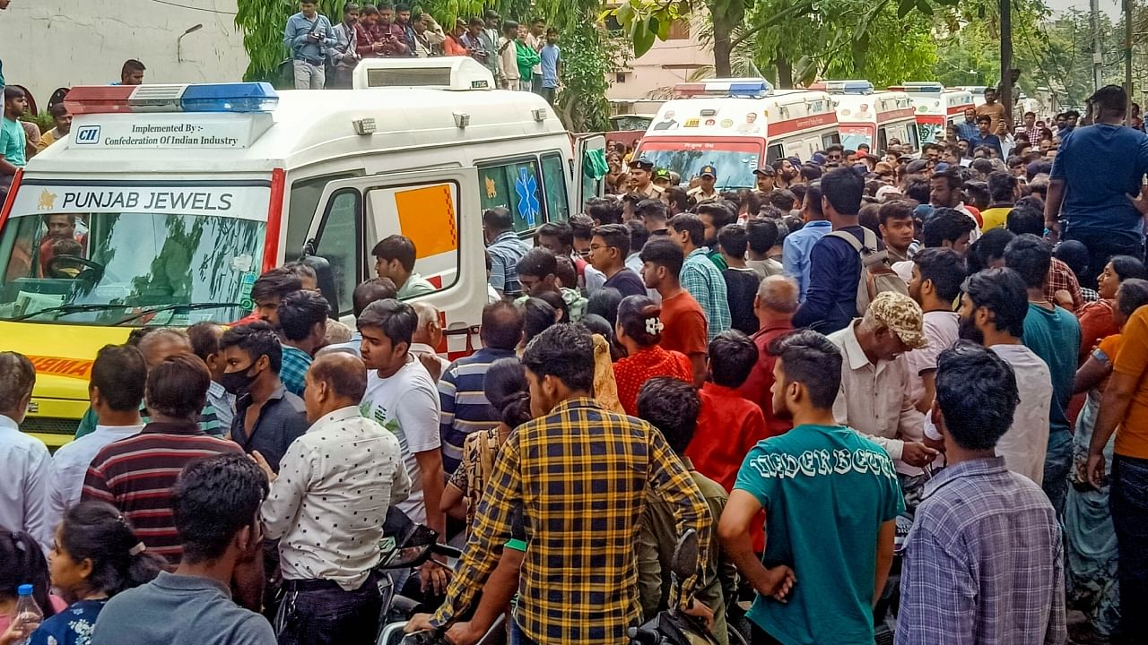 Ambulances arrive at the temple after the roof of an ancient ‘bavdi’ (well) situated in a temple collapsed during Ram Navmi celebrations, in Indore, Thursday, March 30, 2023. At least 25 people are feared to have fallen inside, according to officials. Credit: PTI Photo