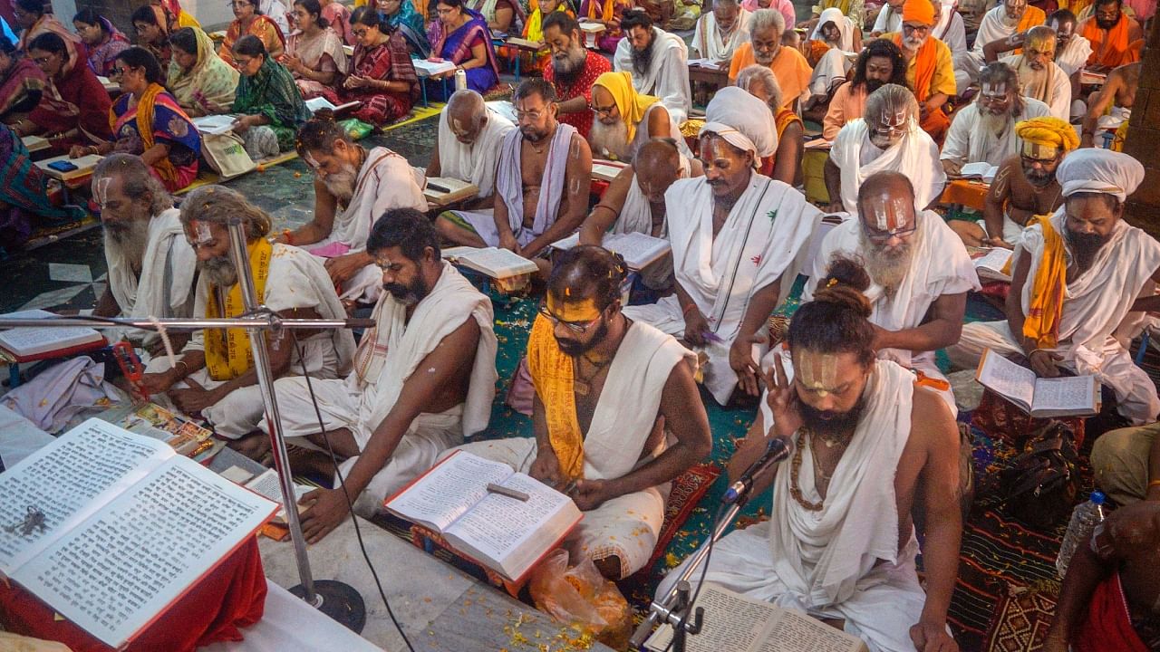 Hindu saints and devotees read Ramcharitmanas while offering prayers on the occasion of Ram Navami during Chaitra Navratri festival, in Bhubaneswar, Thursday, March 30, 2023. Representative Image. Credit: PTI Photo